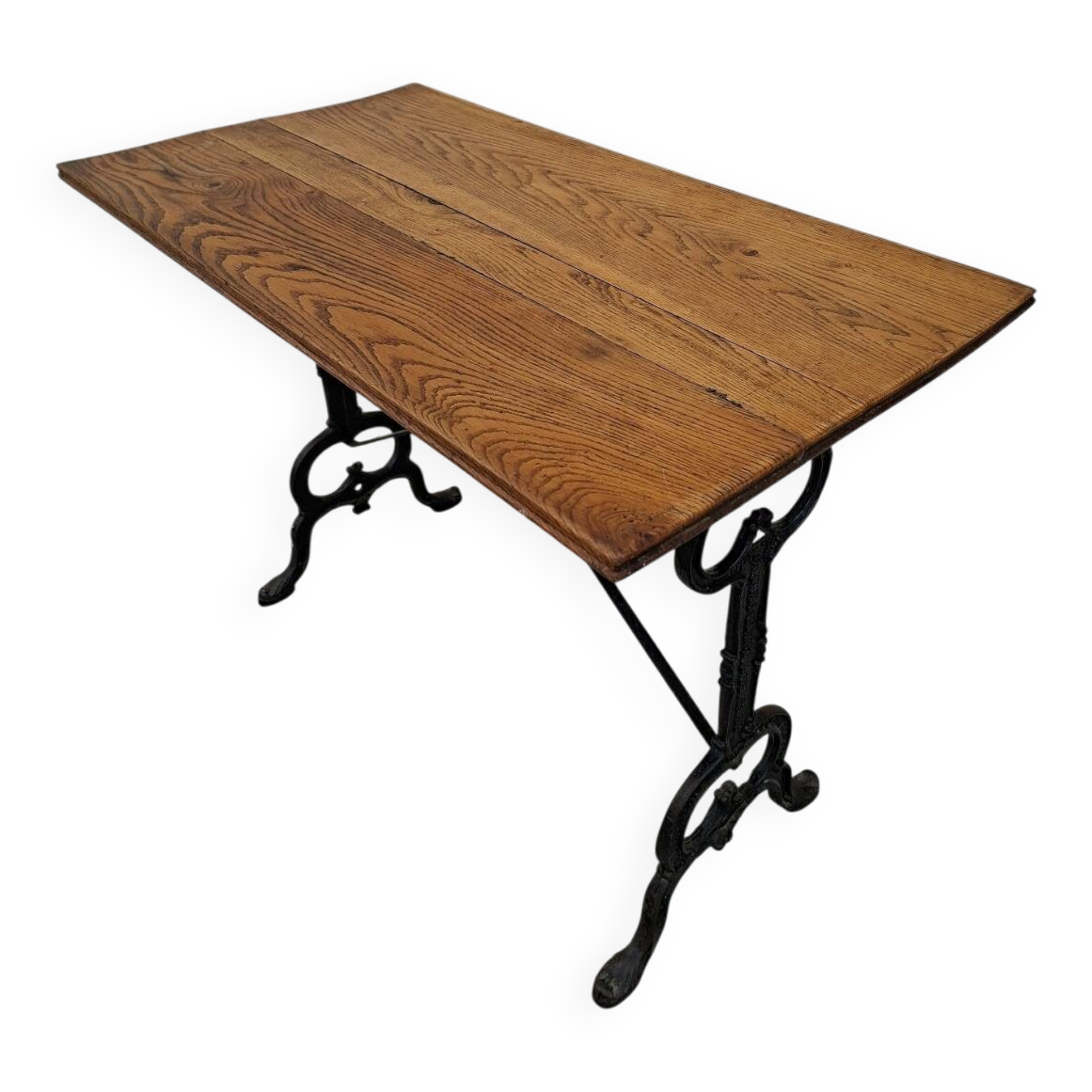 Solid oak bistro table with a cast iron base, signed.