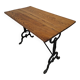 Solid oak bistro table with a cast iron base, signed.