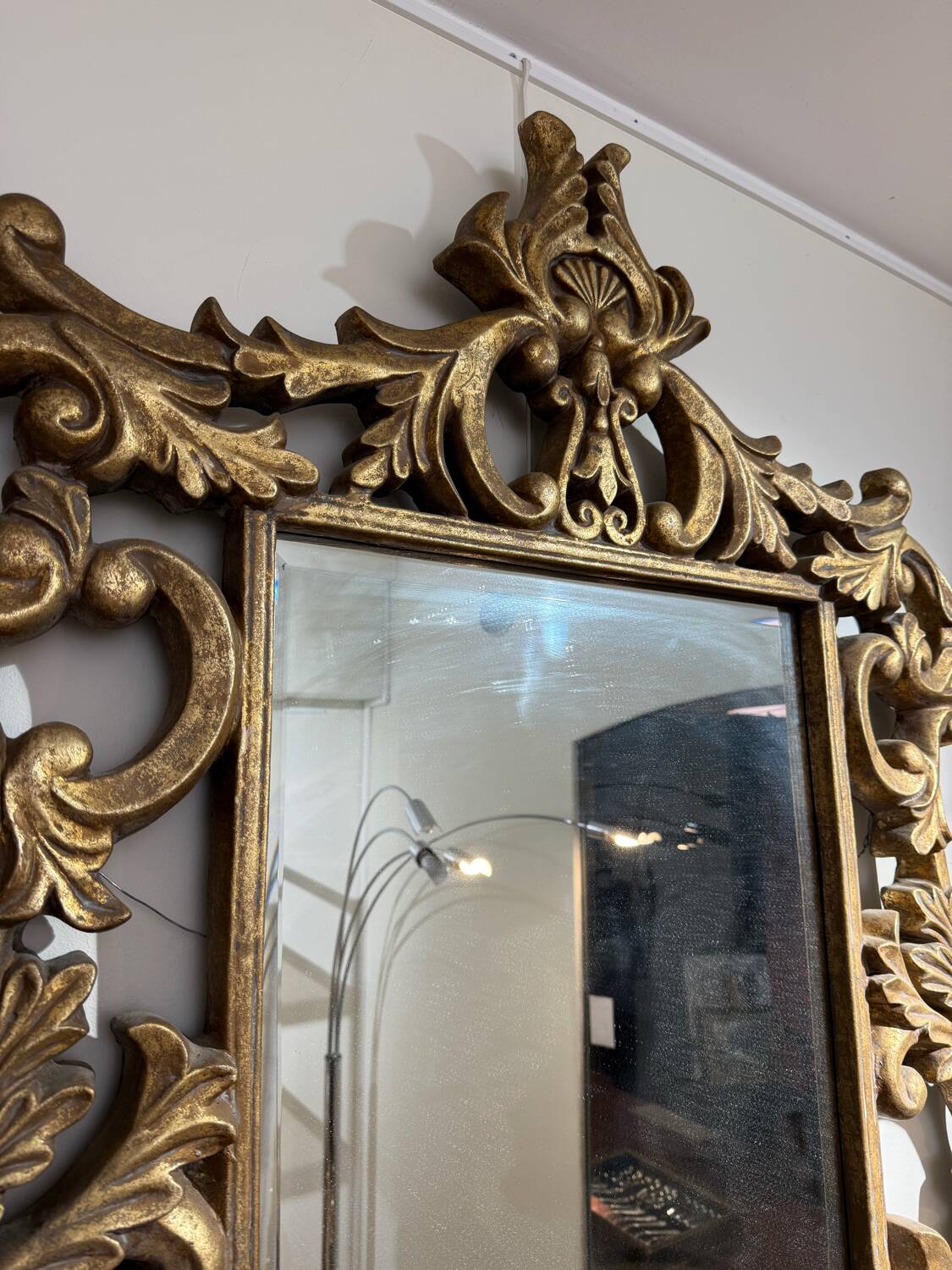 Gold wooden wall mirror with floral decoration