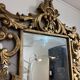 Gold wooden wall mirror with floral decoration