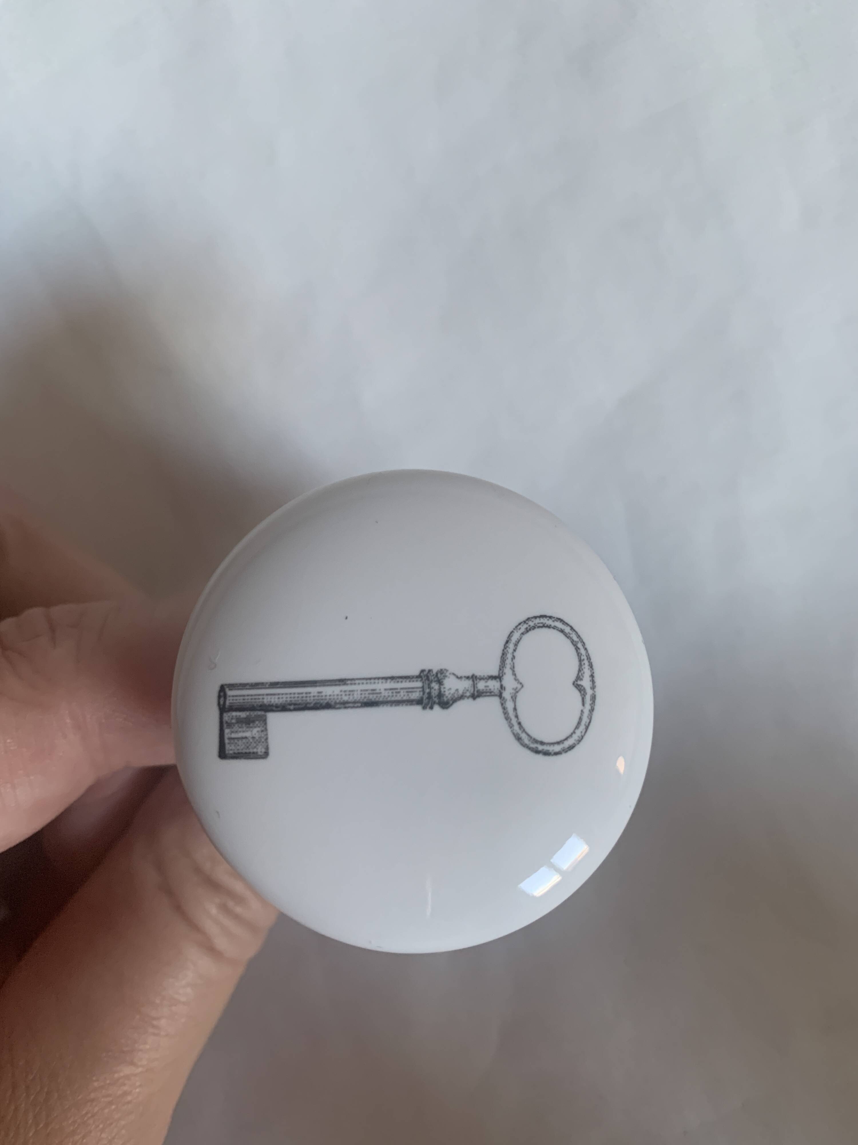 white ceramic door knobs with illustration
