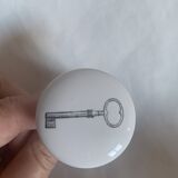 white ceramic door knobs with illustration