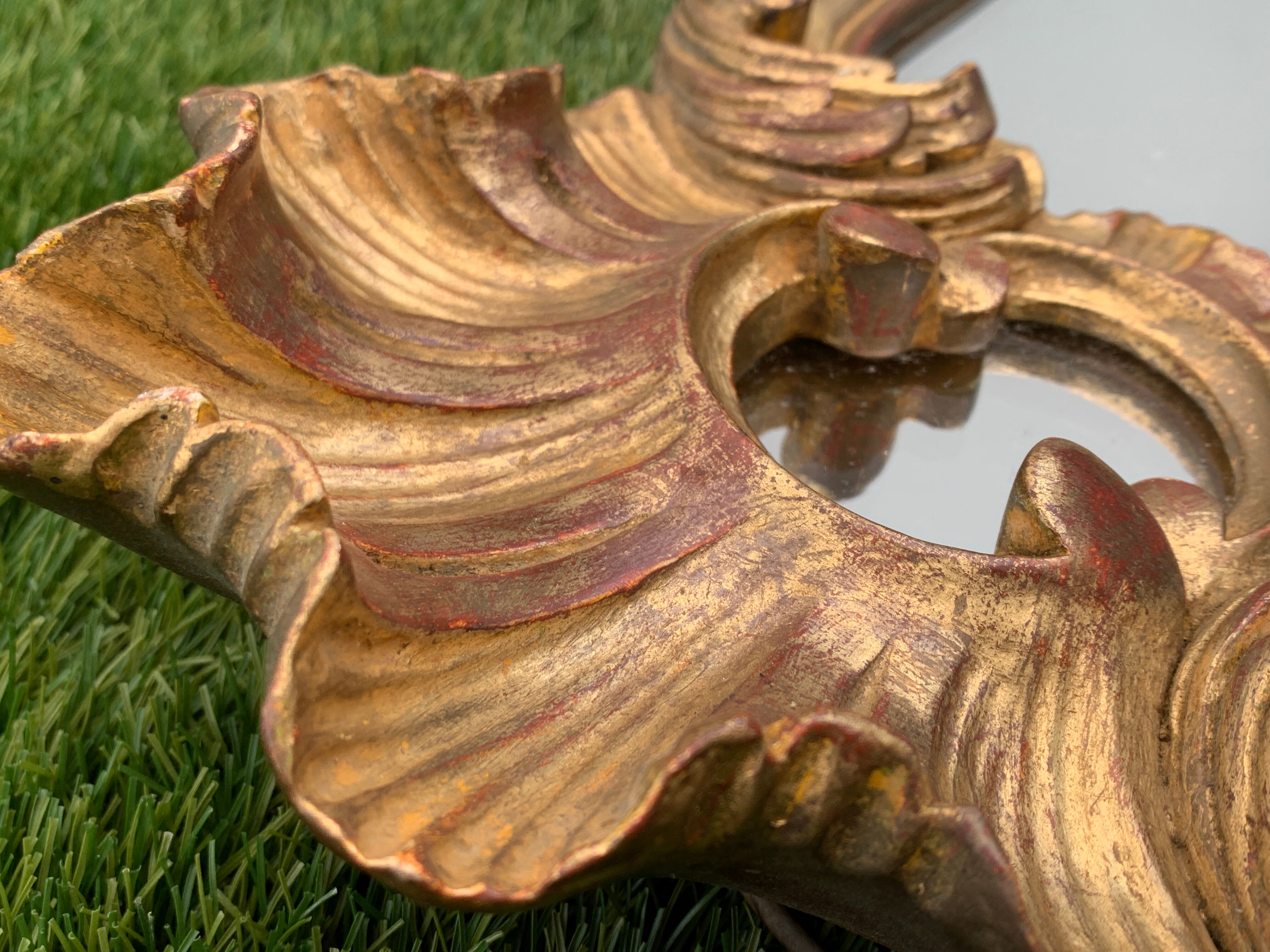 Old mirror in carved wood and gilded leaf, Louis XV rocaille style, twentieth century 59x87cm