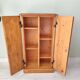 Small wooden piece of furniture, cabinet style, false drawers.