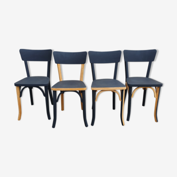 Ensemble de 4 chaises de bistrot Baumann relookées bois brut et noir mat.