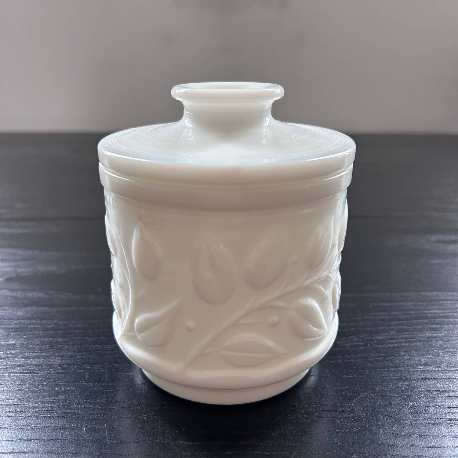 White pot with plant decoration