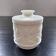 White pot with plant decoration