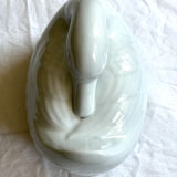 Porcelain duck dish with lid on fire