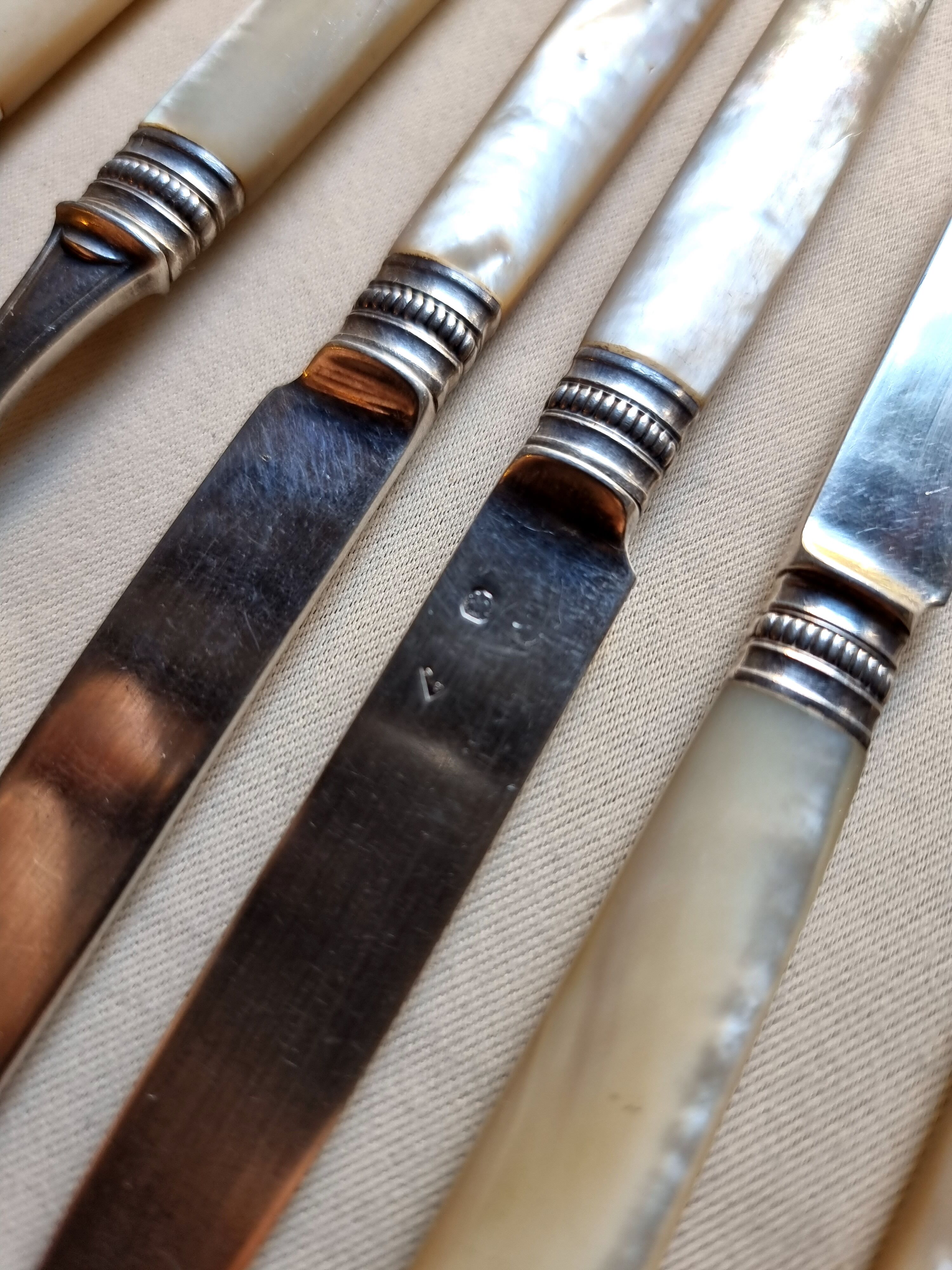 Knives and forks, XIXth, silver blades and forks, mother-of-pearl handle, minerva hallmark