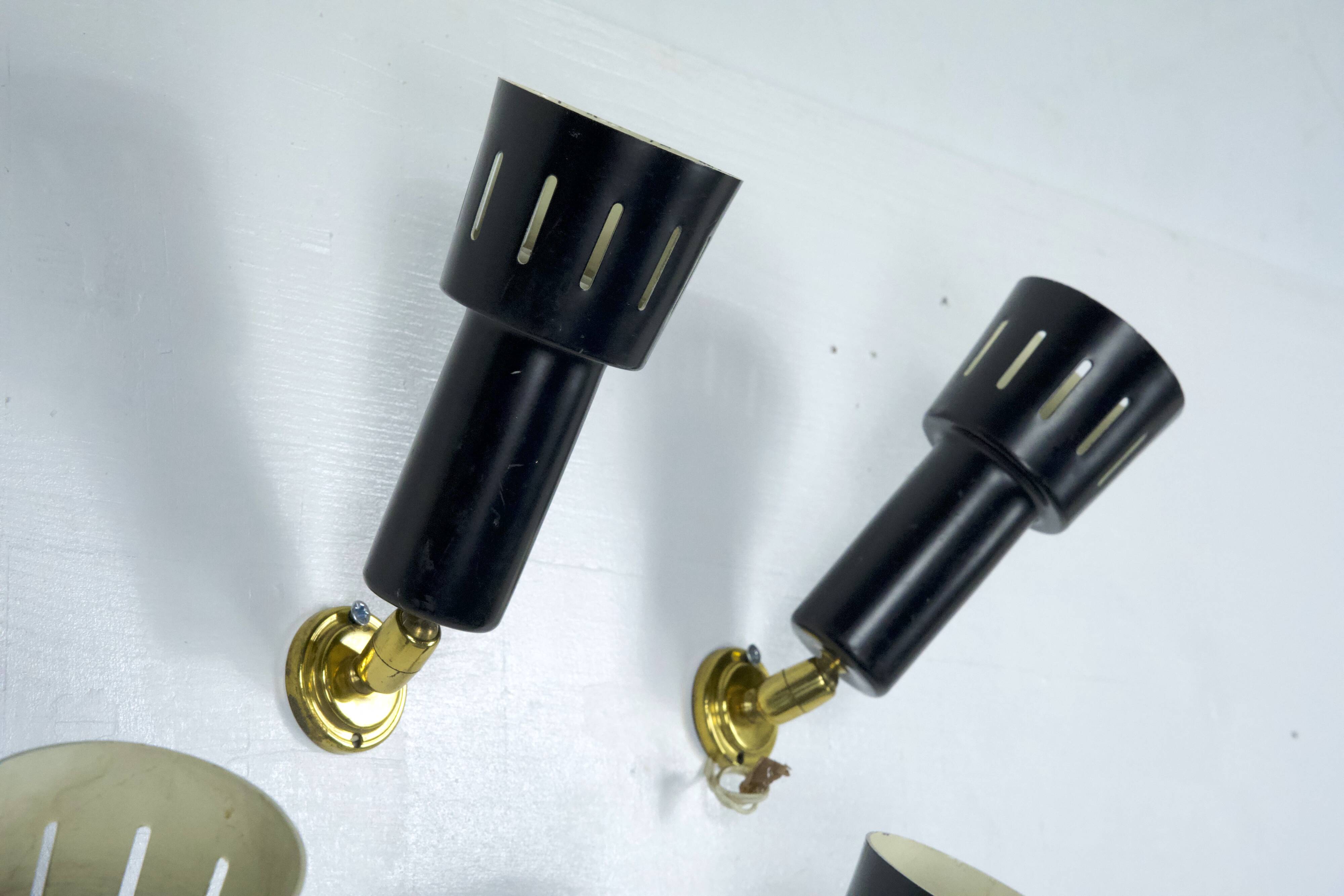 Set of five Stilnovo style spotlights in brass and lacquered metal. Italy