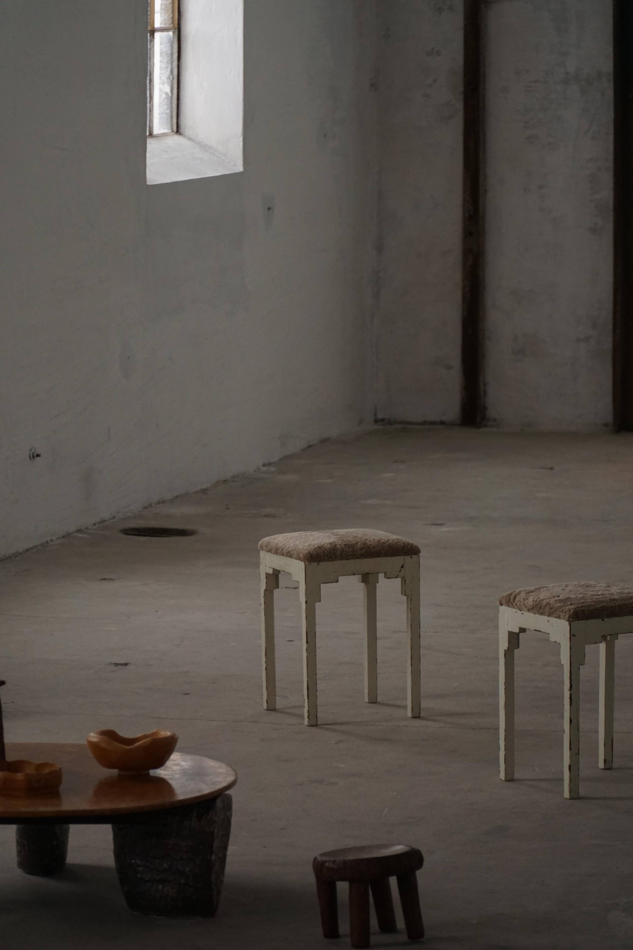A pair of antique Danish stools, seats in lambswool, late 19th century.