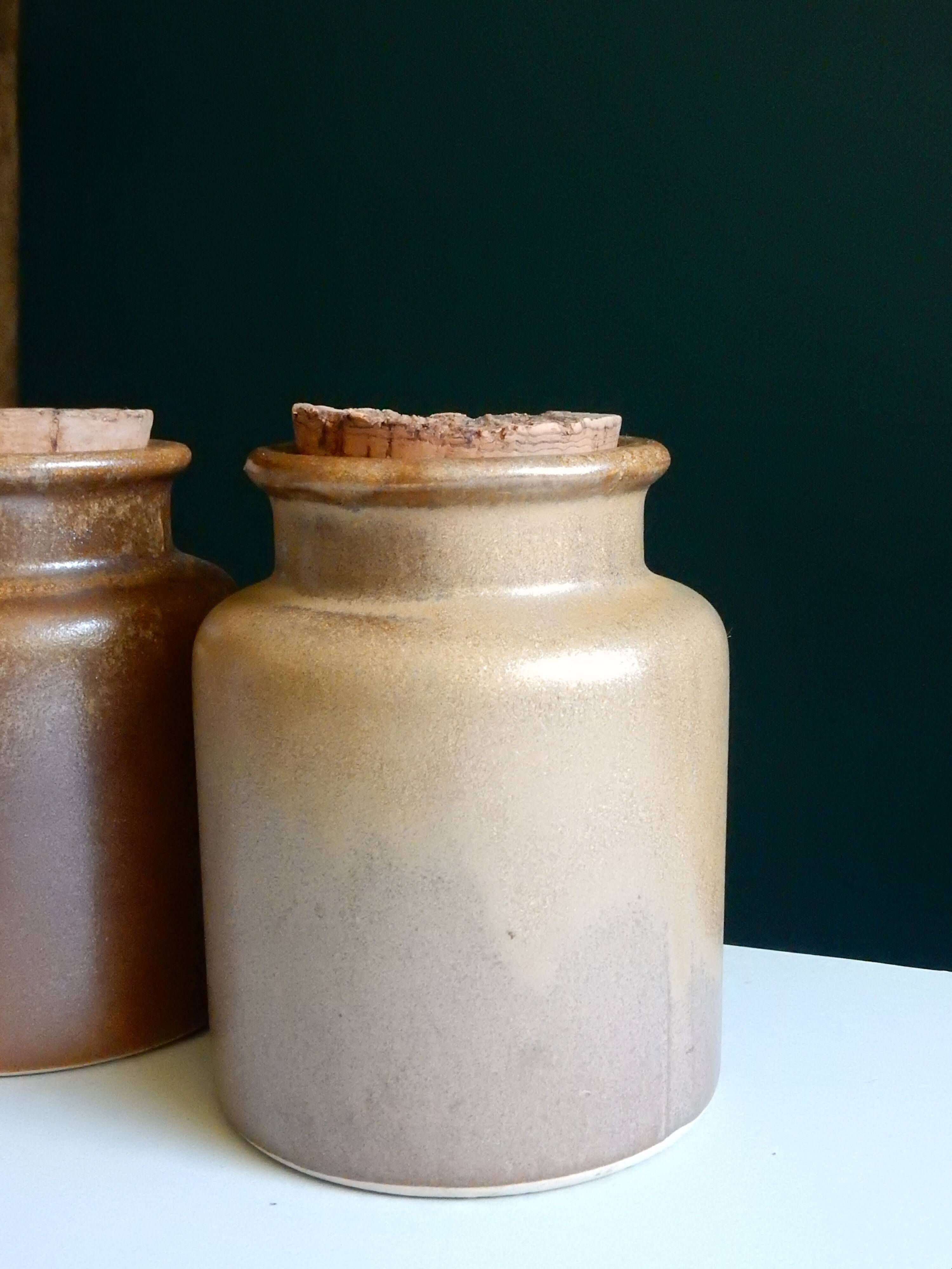 2 brown sandstone mustard pots