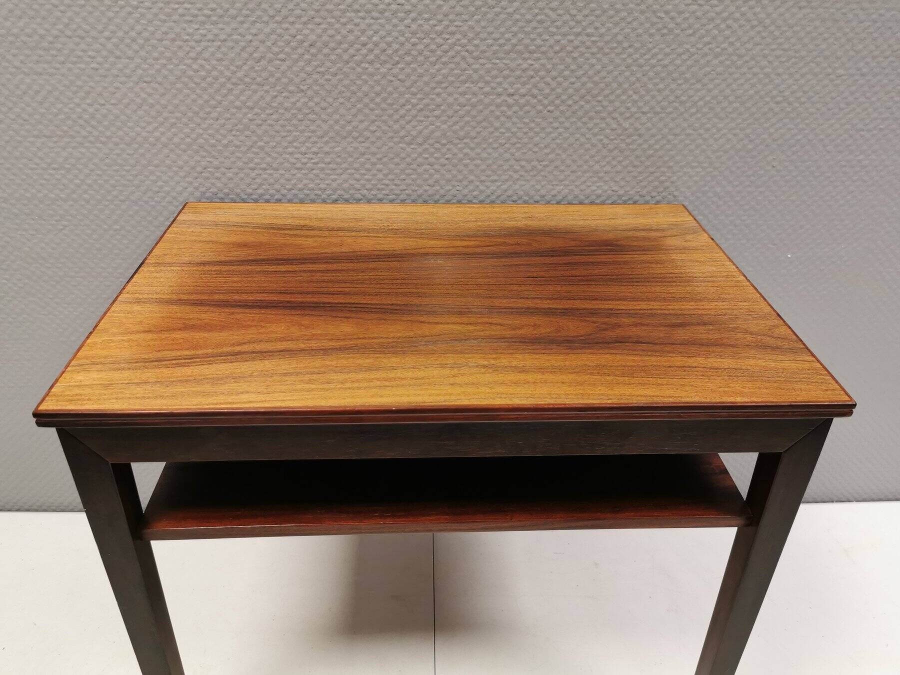 Nice side table in rosewood, probably Danish and from the 60s.