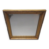 Small old mirror in wood and gilded stucco