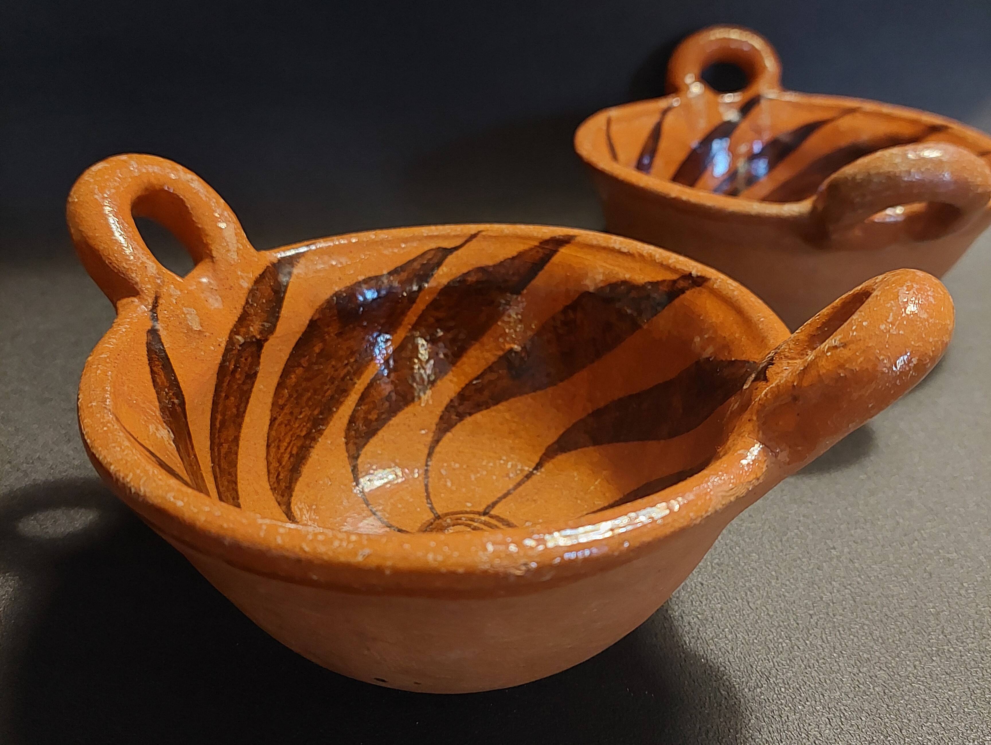 Pair of handled bowls, glazed terracotta, Mexico, mid-20th century.