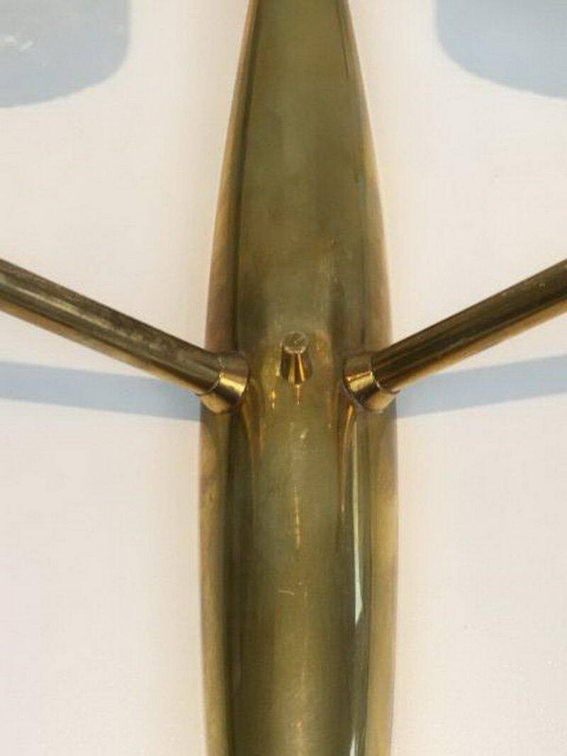 Pair of bronze wall sconces with worked glass reflectors. Stilnovo