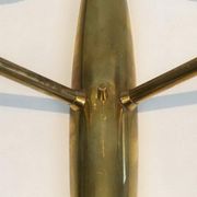 Pair of bronze wall sconces with worked glass reflectors. Stilnovo