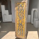 Rectangular Indonesian construction element with blue and yellow plant in carved wood