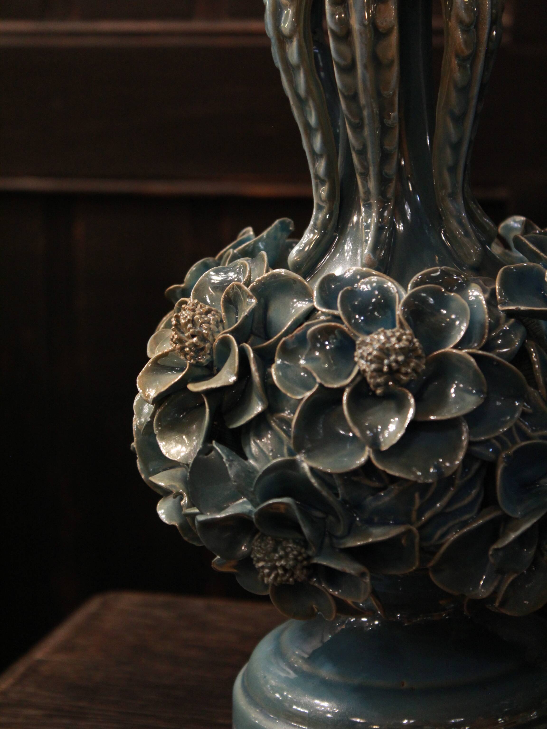 Pair of iridescent light blue lamps, featuring a floral bush design