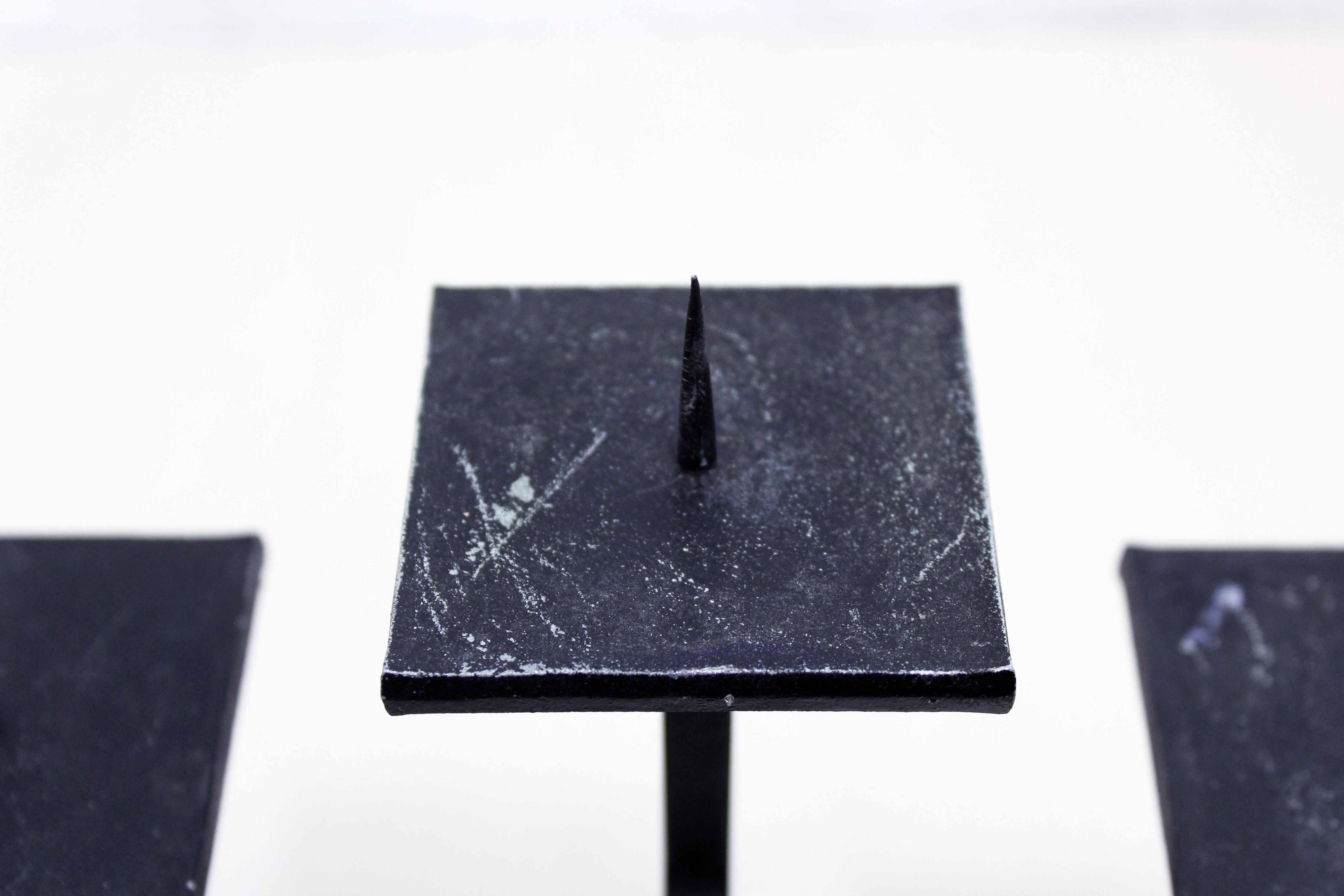 Modernist cast iron candle holder