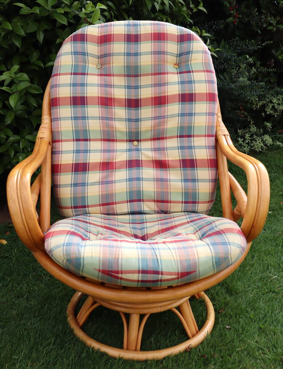 Swivel rattan armchair with matching ottoman