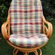 Swivel rattan armchair with matching ottoman