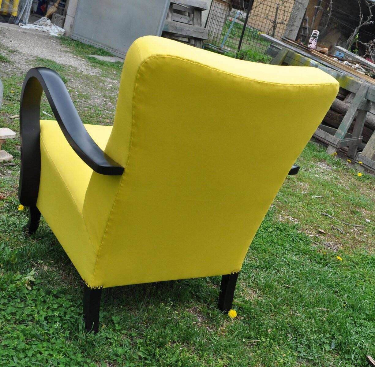 Art Deco armchair in yellow and black, made of painted wood and cotton, high back, 1920s.