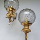 Pair of vintage gold wall sconces with transparent globes
