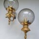 Pair of vintage gold wall sconces with transparent globes