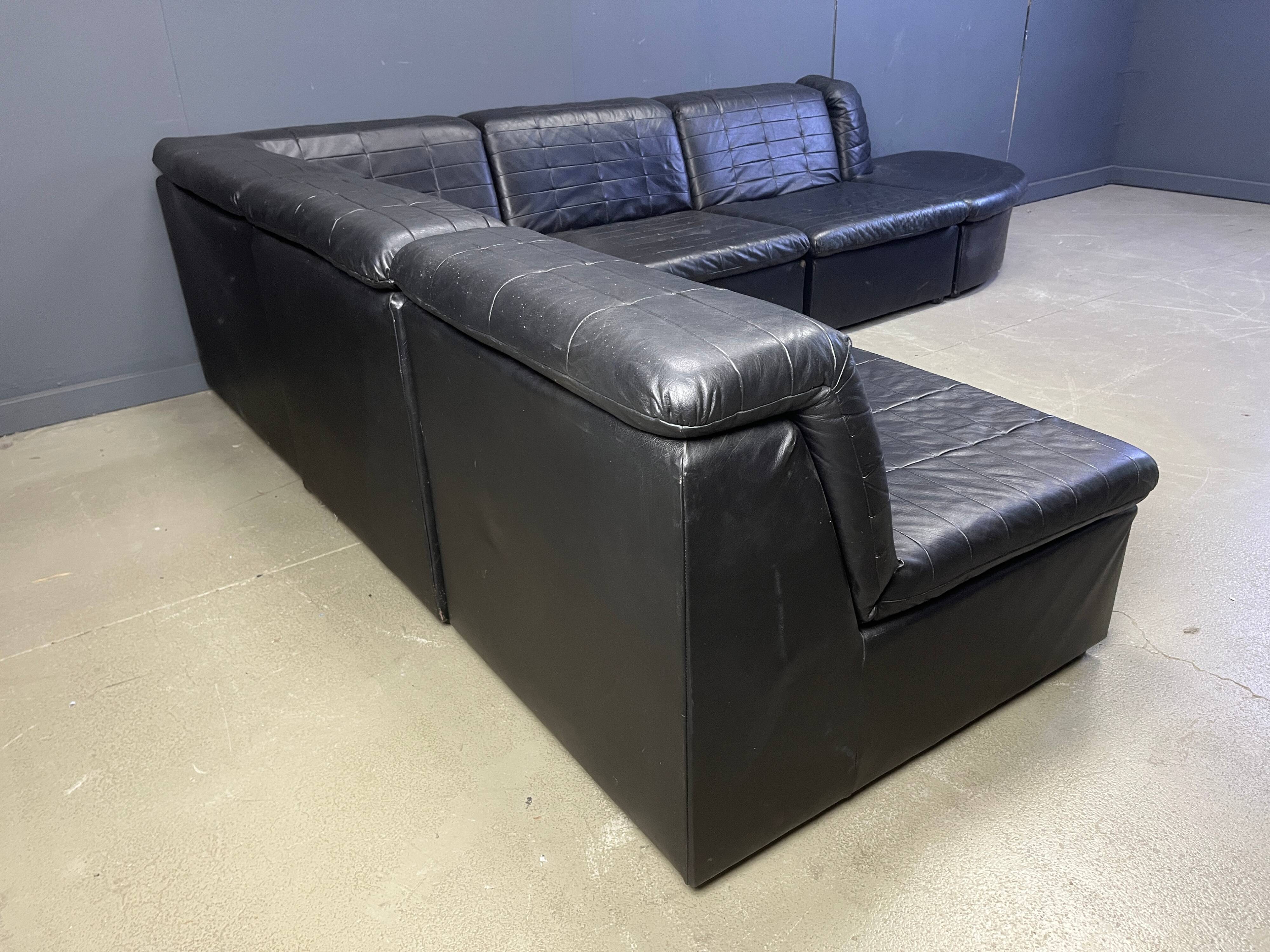 Vintage black patchwork leather modular sofa set by Laauser, 1970s