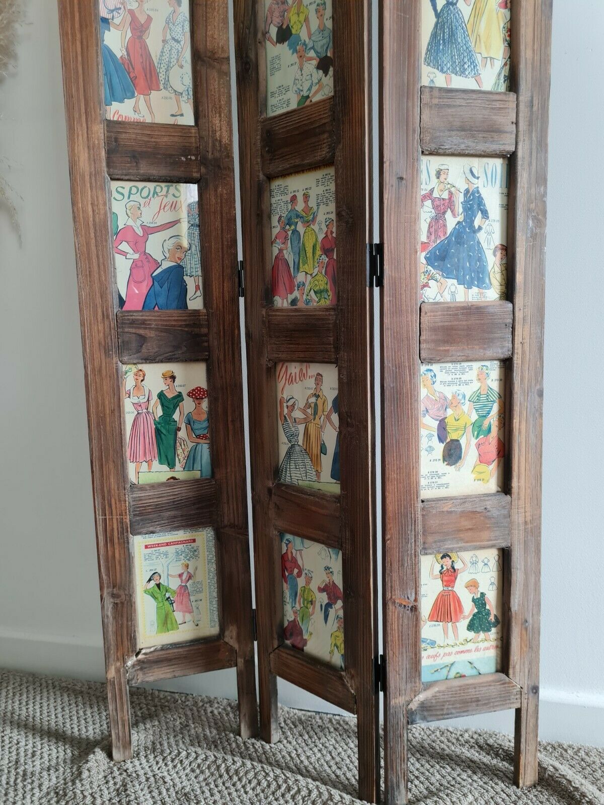 Wooden screen with vintage haute couture images or for photos