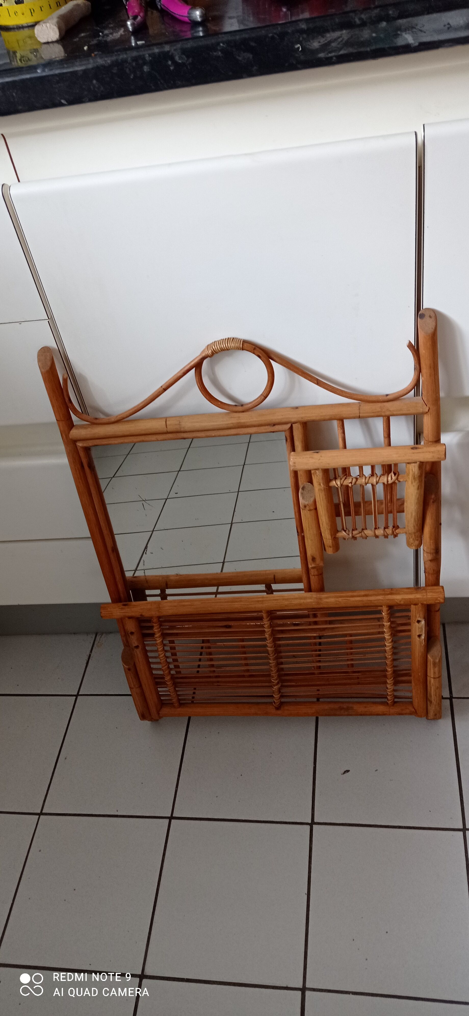 Old bamboo and rattan mirror with vintage folding shelves