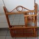 Old bamboo and rattan mirror with vintage folding shelves