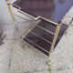 Rolling serving table in brass
