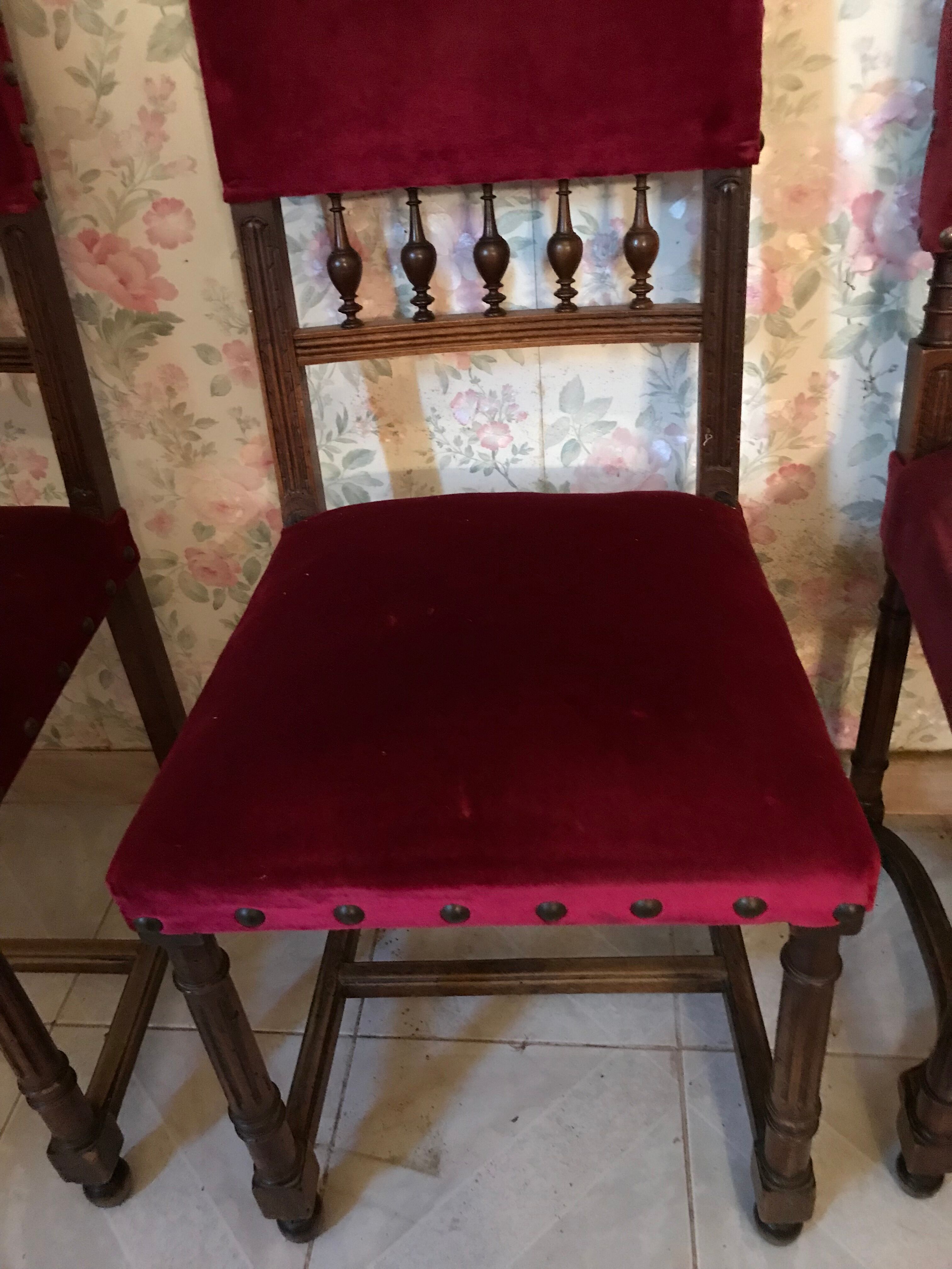 Henri II style chairs covered with red velvet fabric
