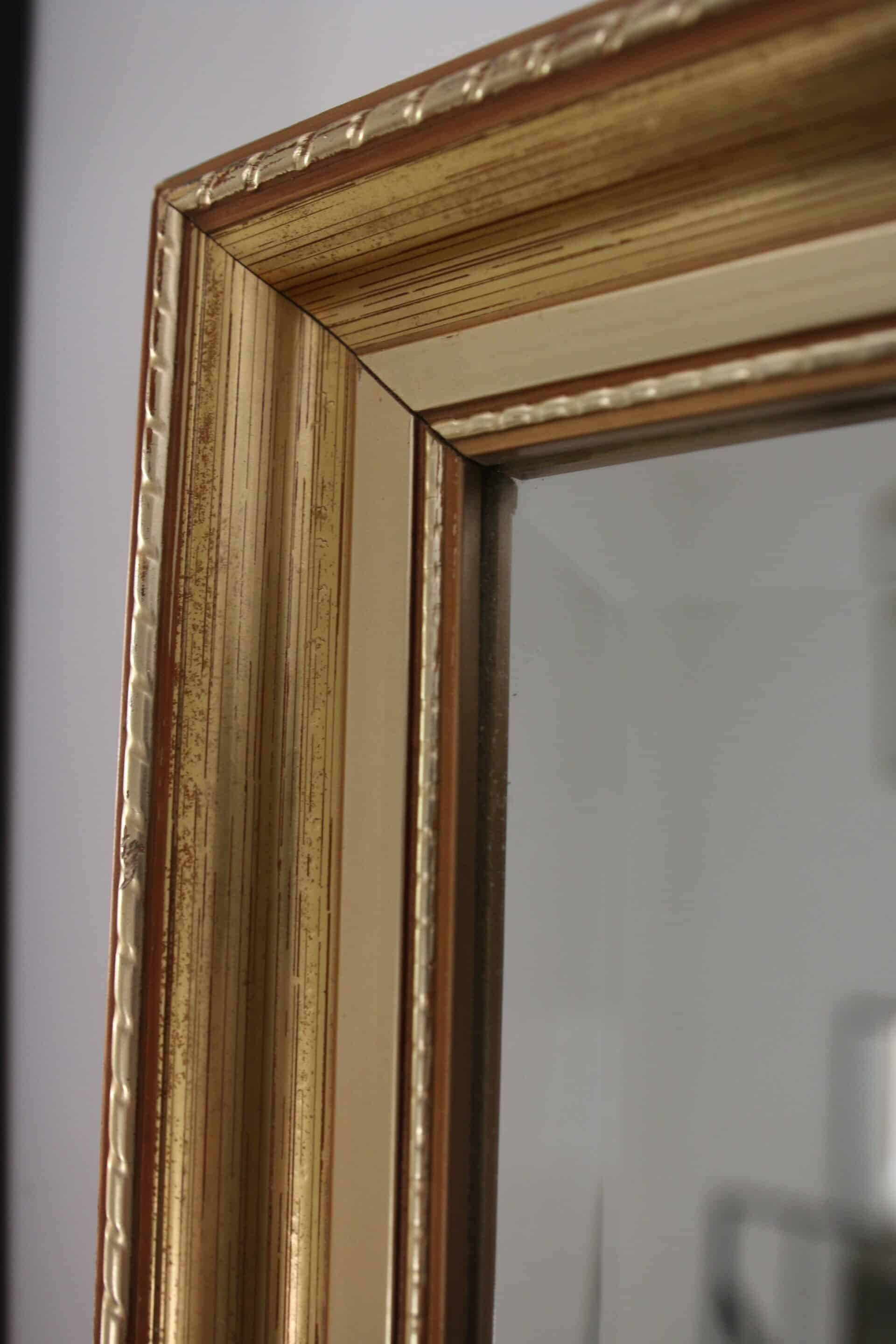 Large beveled mirror in carved wood