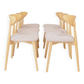 Set of 6 pale pink dining chairs in natural wood.