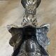 Pair of rococo silver-plated candlesticks