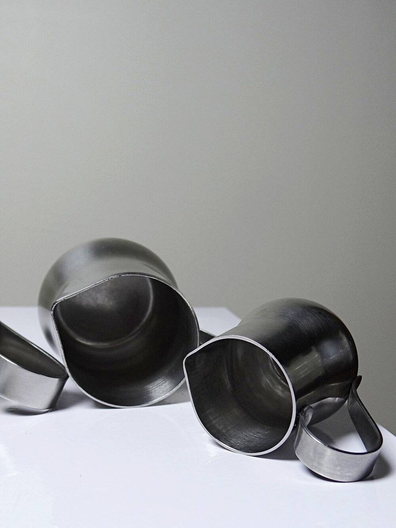 Set of 4 vintage bar measures in brushed stainless steel from the 60s-70s.