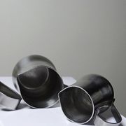 Set of 4 vintage bar measures in brushed stainless steel from the 60s-70s.