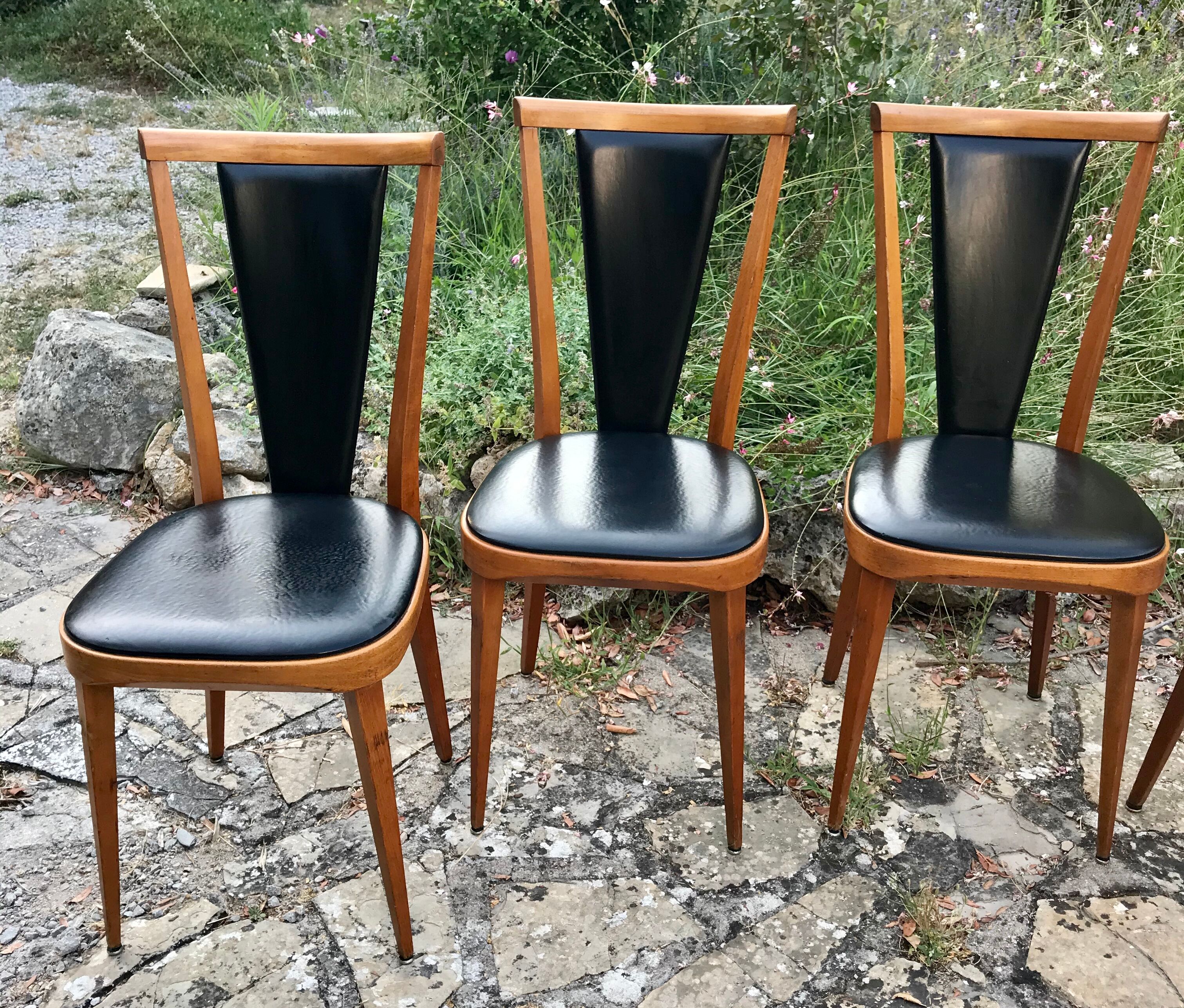 Four vintage beech and skai chairs