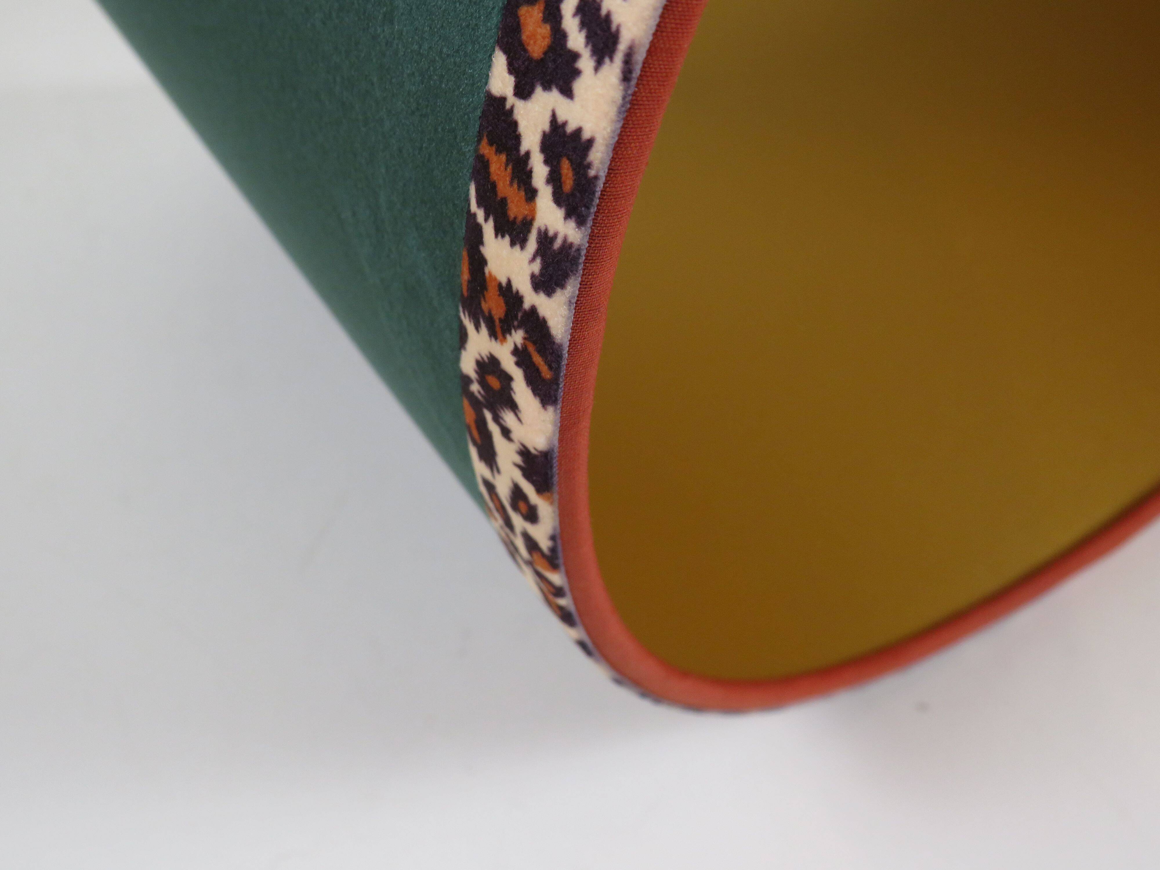 Vintage brass table lamp with green velvet shade.