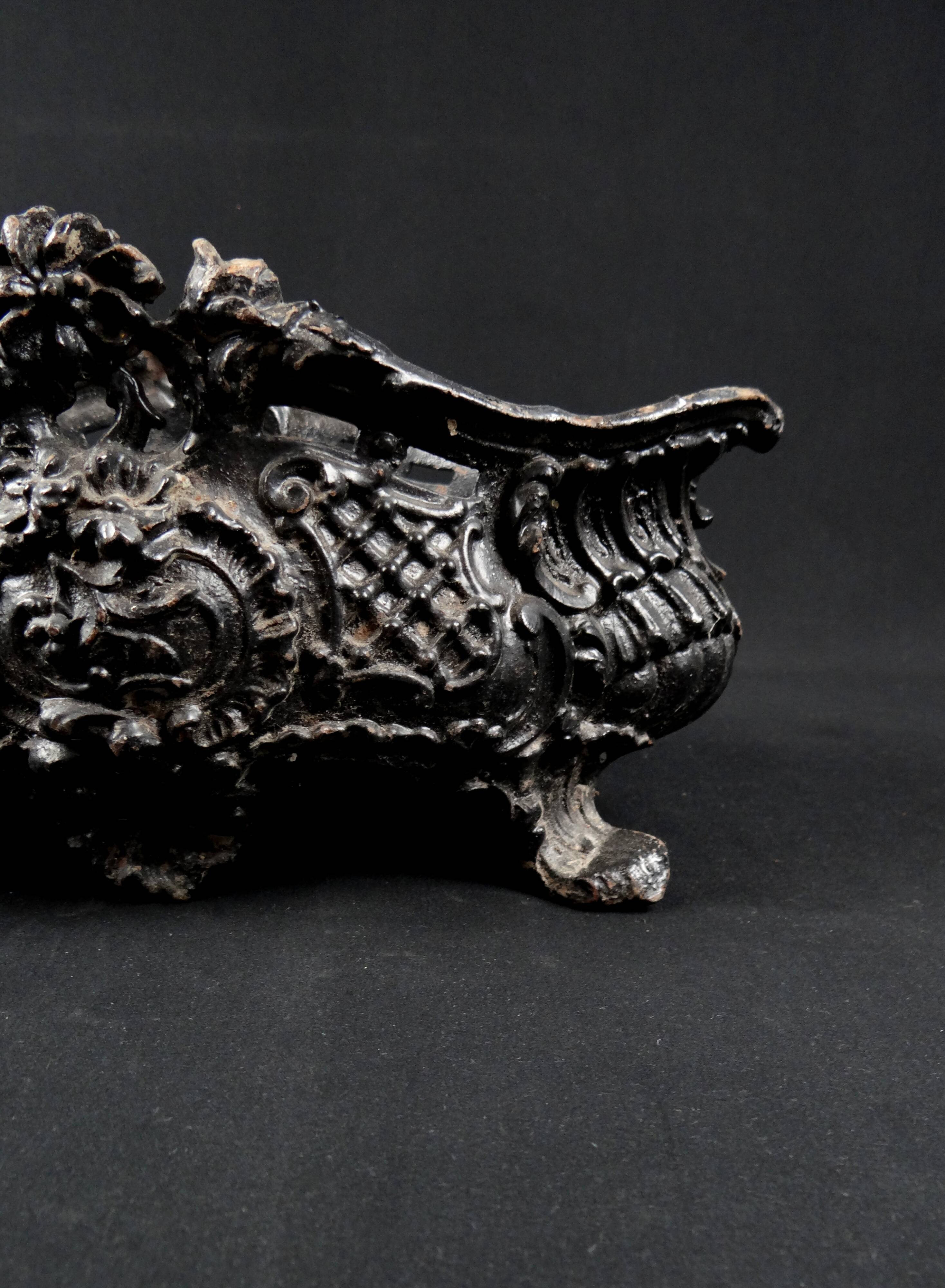 Antique black cast iron planter from the late 19th century Rocaille style