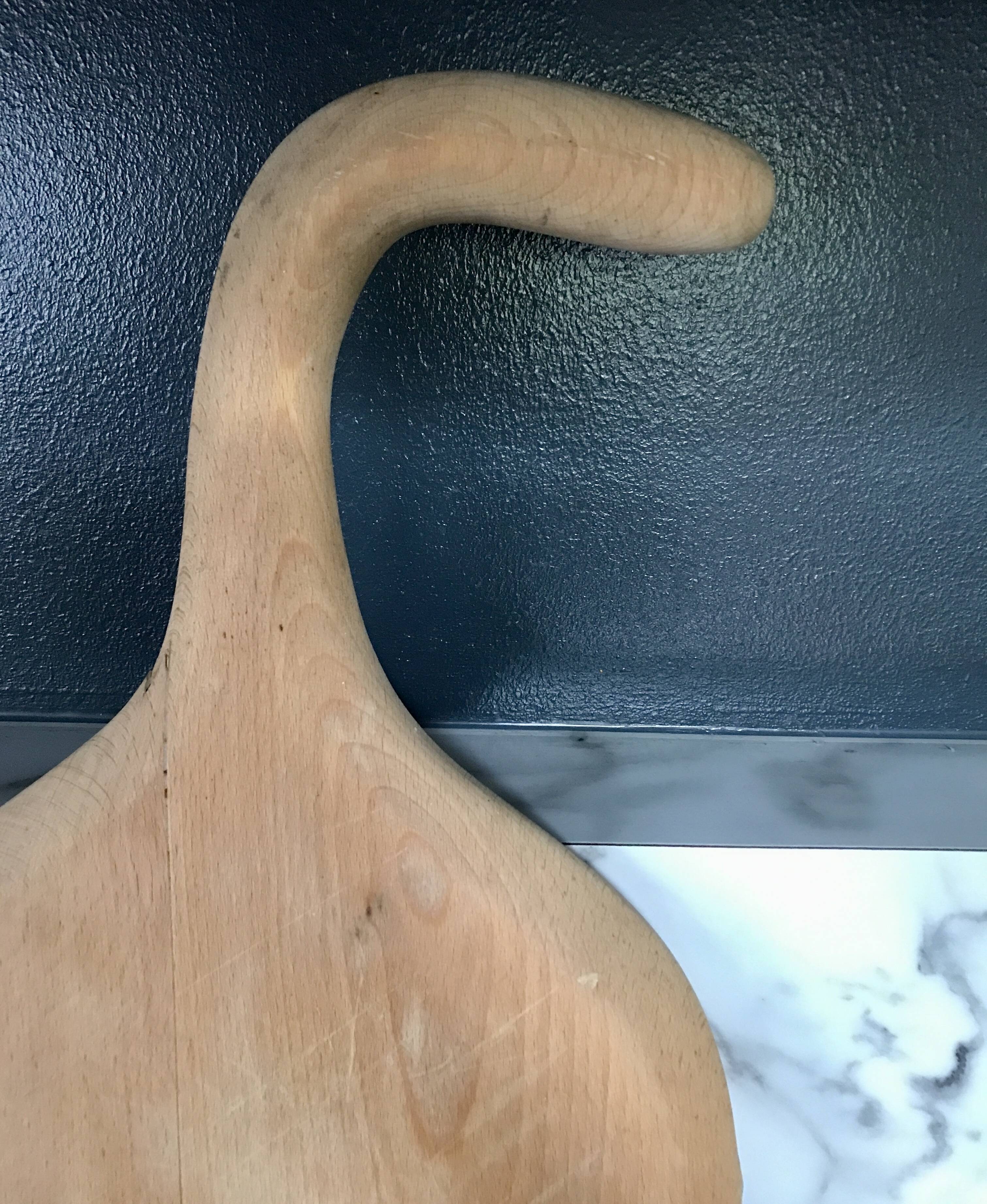 Vintage cutting board with swan neck handle