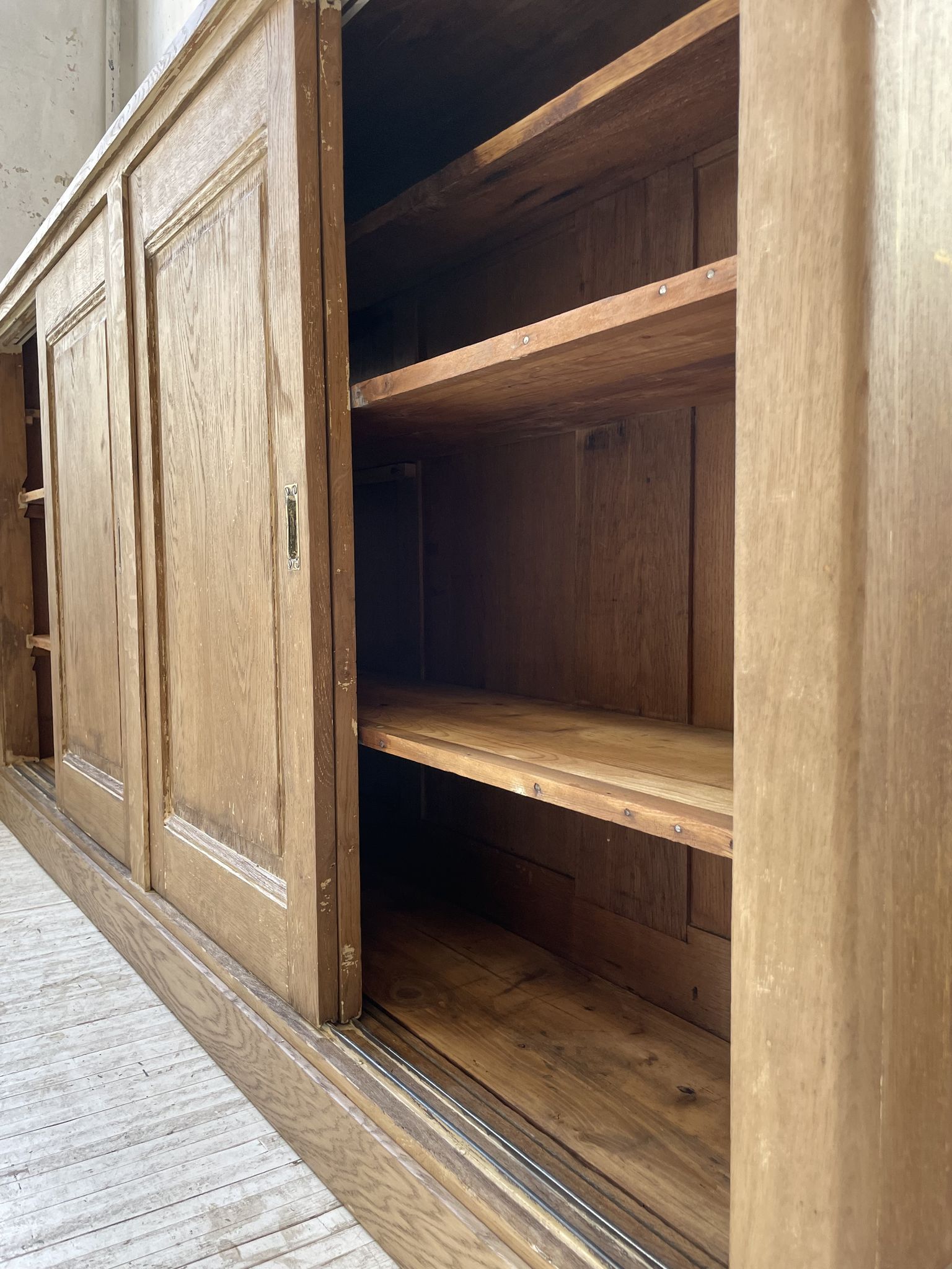 Large row of solid oak loom sliding doors