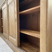 Large row of solid oak loom sliding doors