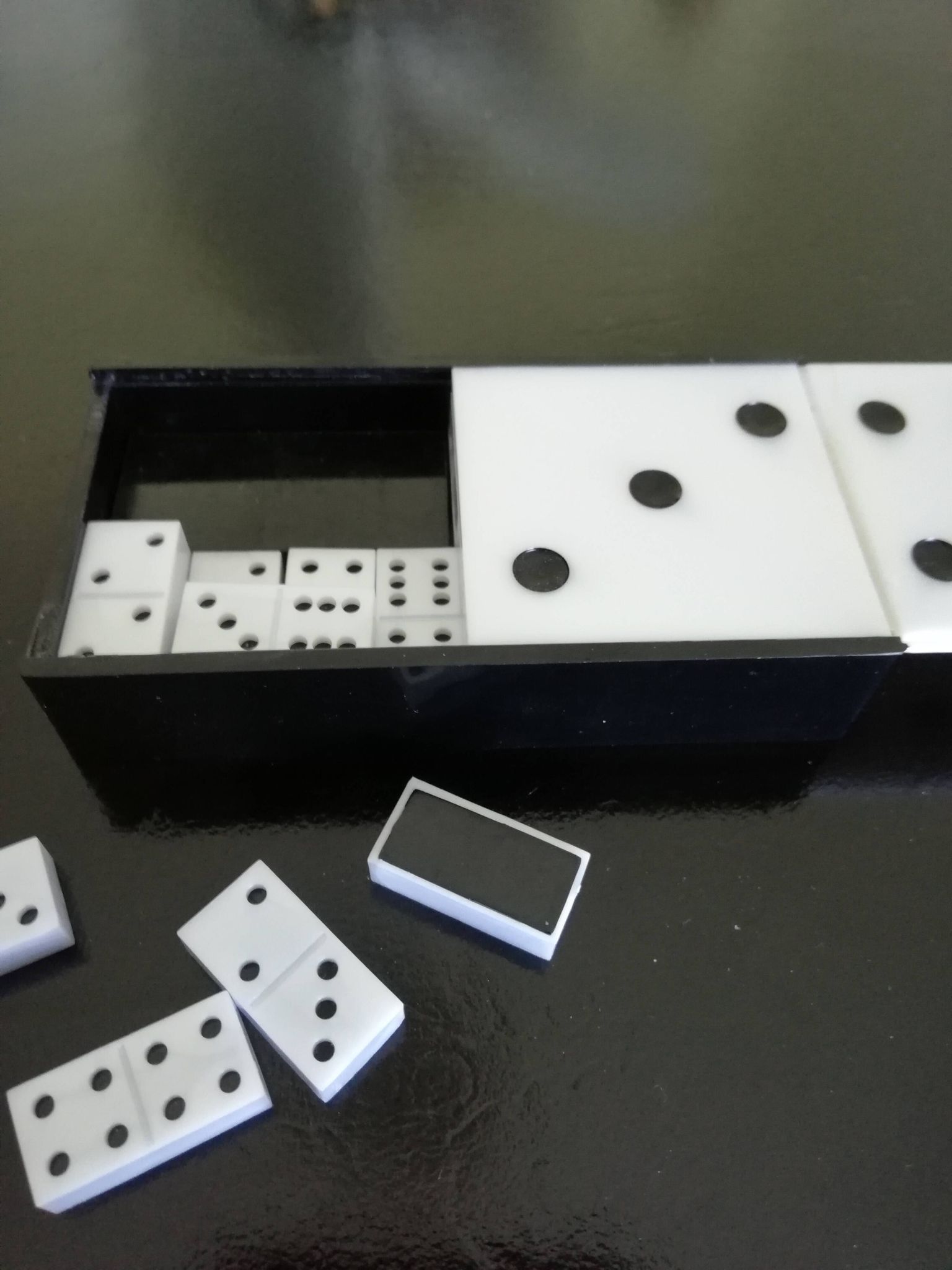 Complete set of Miniature Dominos in a Black and White Box.