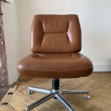 Pair of cognac-colored swivel armchairs