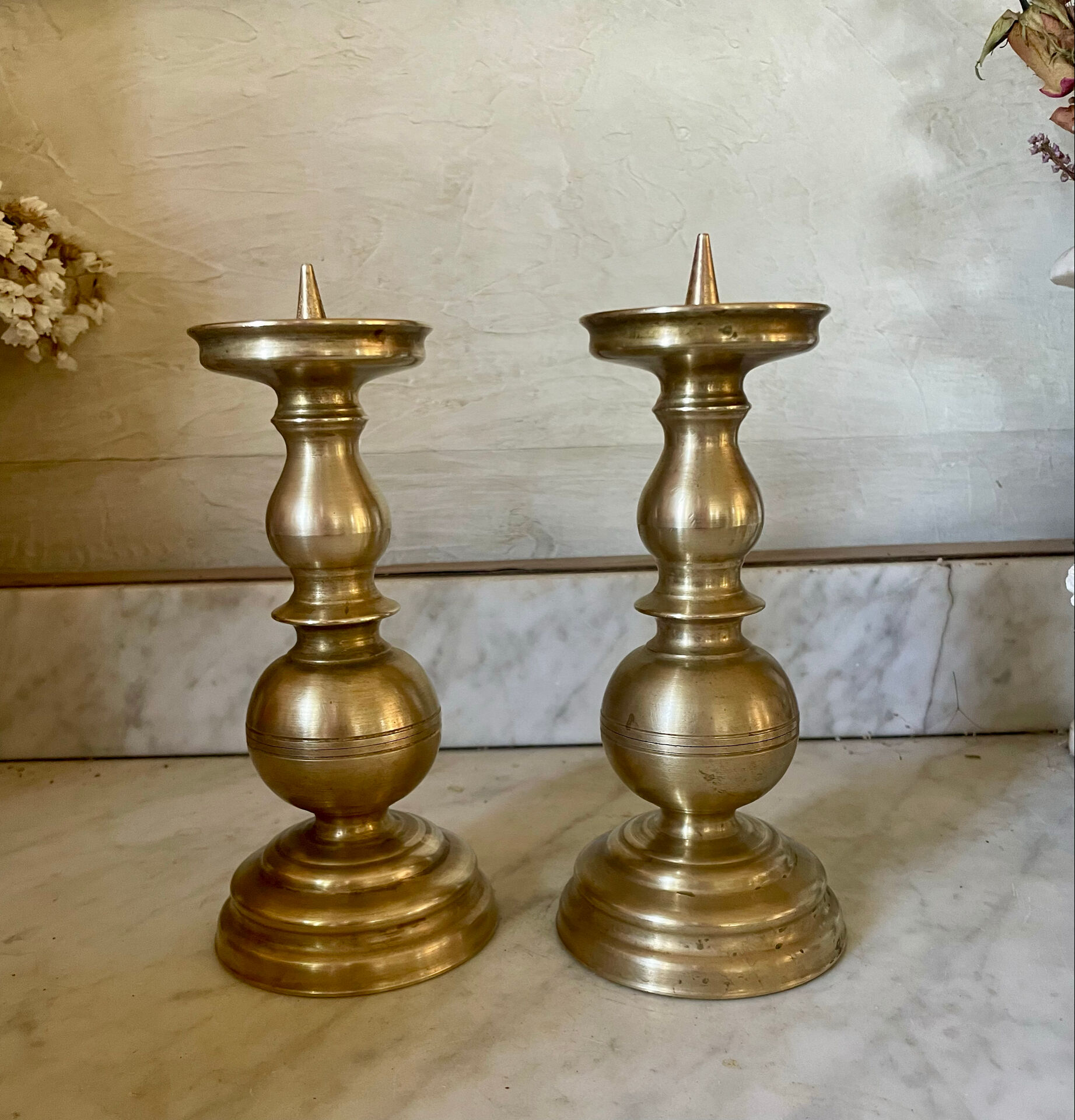 Pair of solid brass candlesticks from the 19th century.
