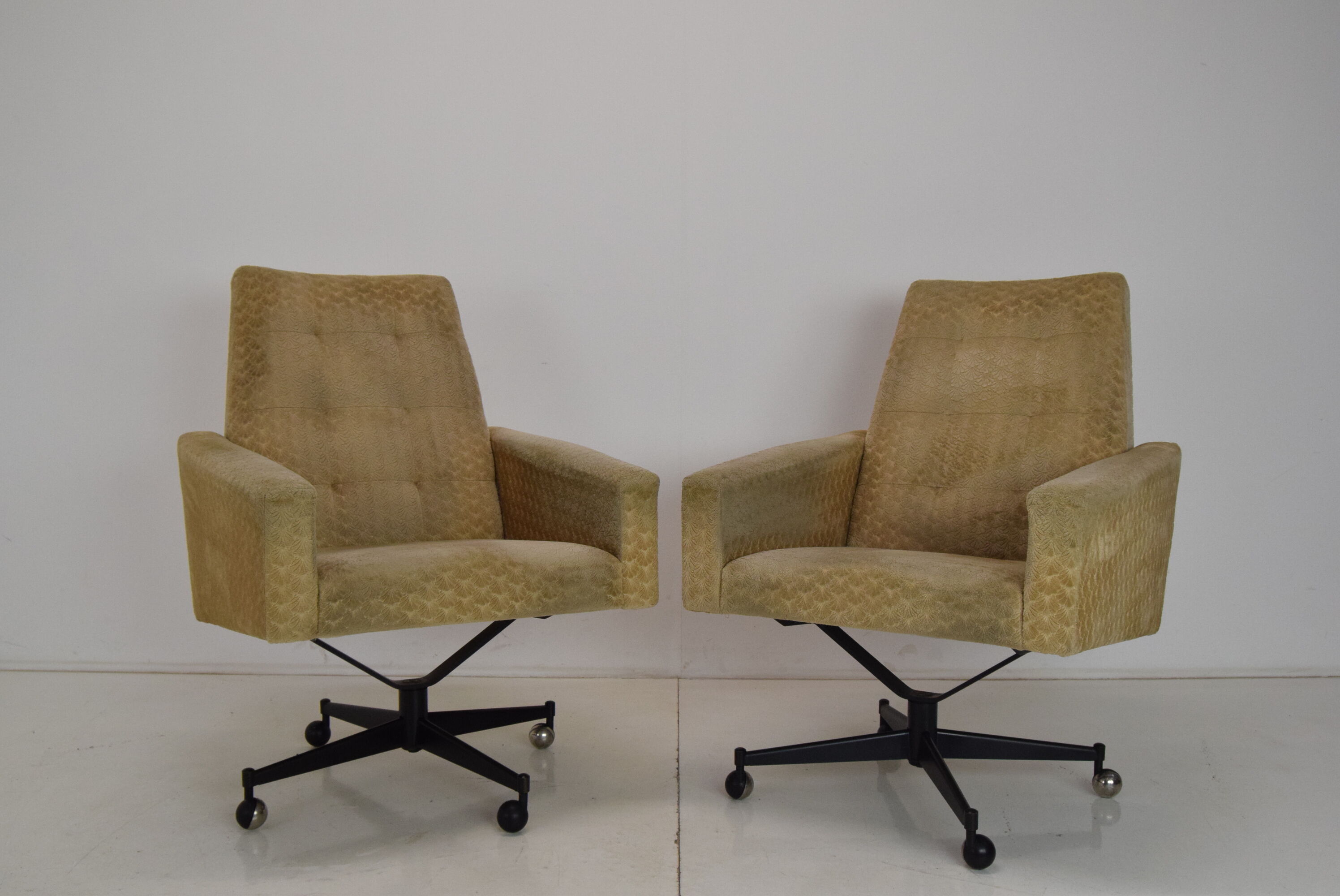 Pair of mid-century swivel armchairs with wheels 1970's